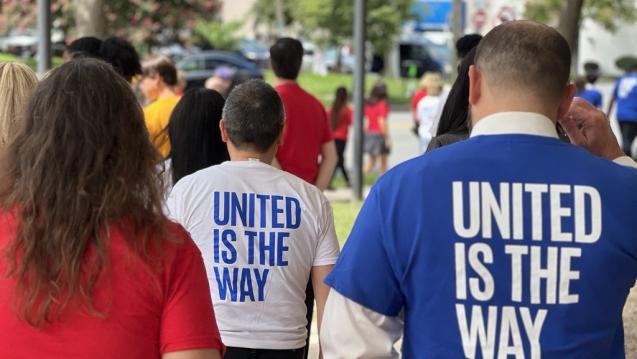 People wearing United Is The Way T-shirts